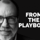 MAN WITH GLASSES WITH FORM THE PLAYBOOK IN LETTERS NEXT TO HIMI